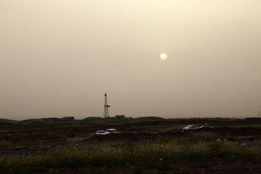 Picnic at sunset and oil field 